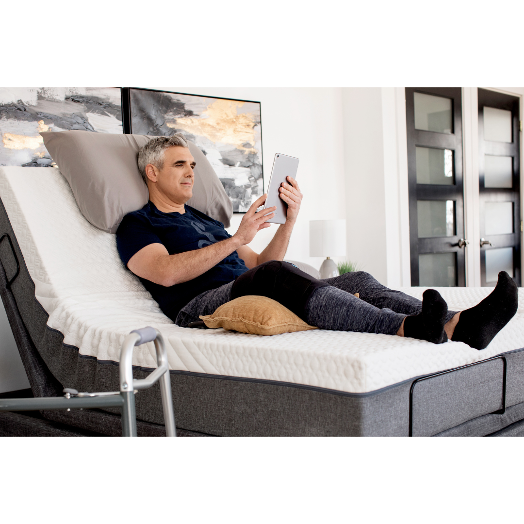 Golden Passport™ Hi Low Adjustable Bed with Dual-Zone Vibrating Massage - With user in seated position