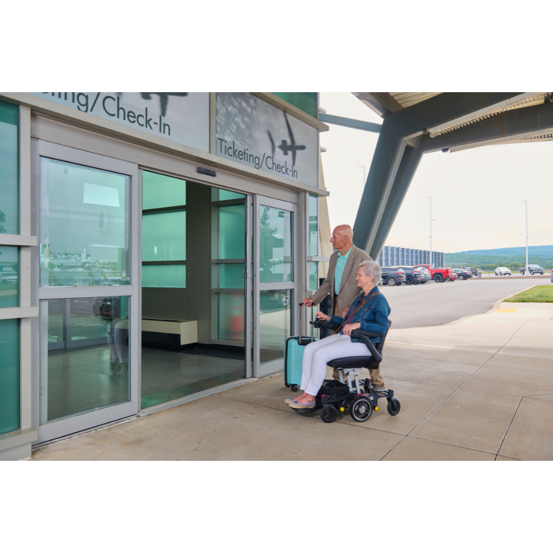 Golden Tech GP130  FAA Approved Buzzaround CarryOn Portable Power Wheelchair - user operating outside the airport